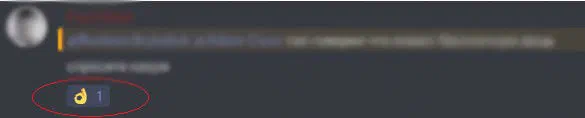 Chat message with a blurred text and an OK hand reaction circled in red
